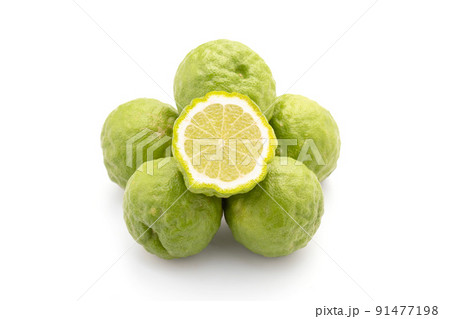 Slice of Thai bergamot isolated on white background. Food and healthcare concept Slice of Thai bergamot isolated on white background. Food and healthcare concept 91477198