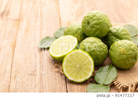 Slice of Thai bergamot on wooden table background. Food and healthcare concept 91477217