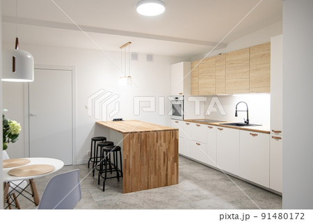 Modern apartment kitchen with a counte Modern apartment kitchen with a counte 91480172