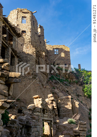 ruined old high stone houses in the abandoned village of Gamsutl, Dagestan ruined old high stone houses in the abandoned village of Gamsutl, Dagestan 91481271