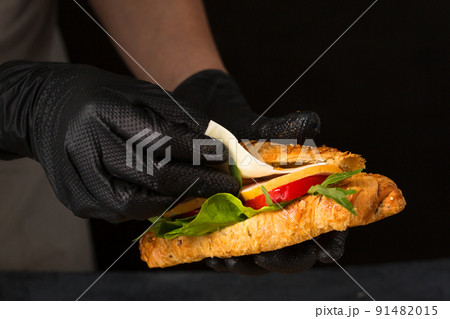 The chef puts the cheese The chef puts the cheese 91482015