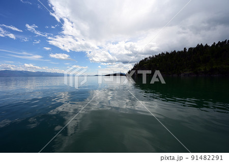 Beautiful dramatic summer cloudscape over Flathead Lake in Montana. Beautiful dramatic summer cloudscape over Flathead Lake in Montana. 91482291