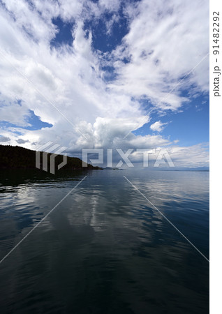 Beautiful dramatic summer cloudscape over Flathead Lake in Montana. Beautiful dramatic summer cloudscape over Flathead Lake in Montana. 91482292
