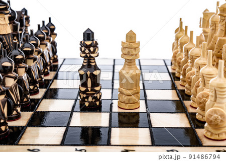 Beige Brown Wooden chess different pieces figures standing on chessboard. Closeup game concept competition, Classic Tournament. 91486794