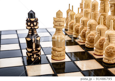 Beige Brown Wooden chess different pieces figures standing on chessboard. Closeup game concept competition, Classic Tournament. Beige Brown Wooden chess different pieces figures standing on chessboard. Closeup game concept competition, Classic Tournament. 91486795