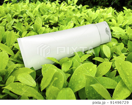 cosmetic plastic tube on green leaf background 91496729