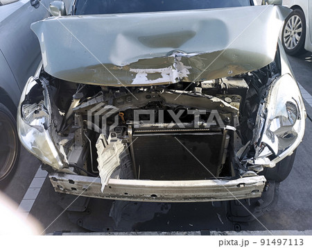 The front of the car was damaged in a road accident The front of the car was damaged in a road accident 91497113
