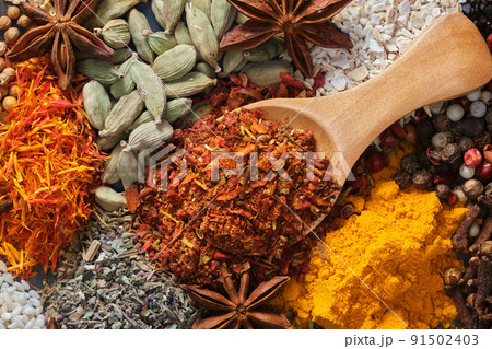 Spices. Aromatic Indian spices on a slate background. Spices and herbs on stone 91502403