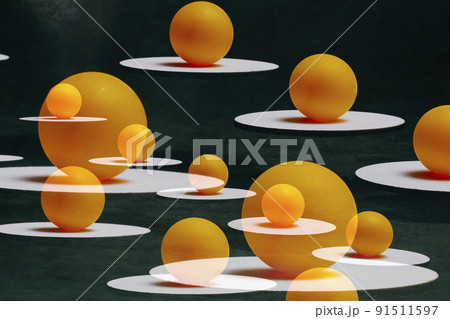 Abstract still life with orange balls on white sands suspended in the air Abstract still life with orange balls on white sands suspended in the air 91511597