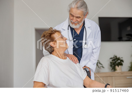 Doctor supporting a sick patient before medical procedures in a hospital room Doctor supporting a sick patient before medical procedures in a hospital room 91517460