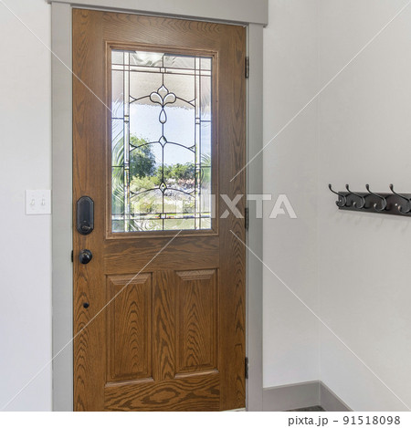 Square frame Interior of a front door with wall rail-mounted hanging hooks 91518098