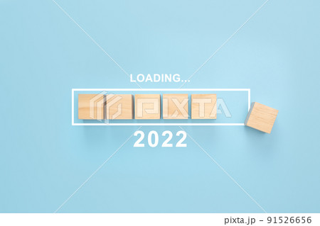 Business concept of planning 2022. Loading new year 2022 wood cube in progress bar. blue background Business concept of planning 2022. Loading new year 2022 wood cube in progress bar. blue background 91526656