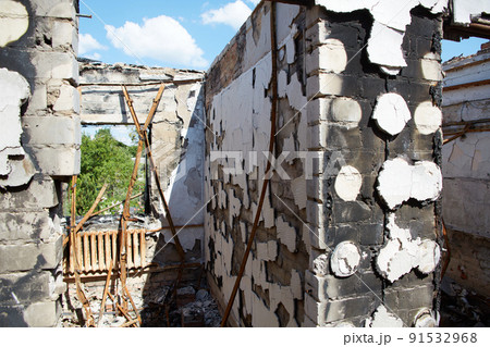 View from the ruined houses on the street after the air raid. 91532968
