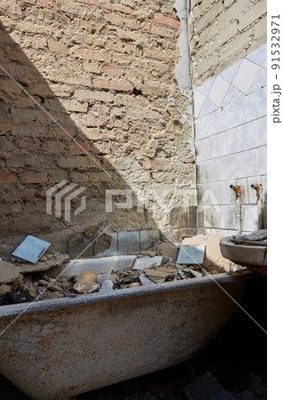 View from the ruined houses on the street after the air raid. 91532971