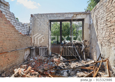 View from the ruined houses on the street after the air raid. 91532986