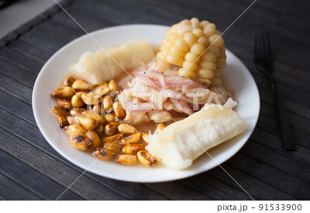 Peruvian traditional dish.fish ceviche with yuka and corn 91533900