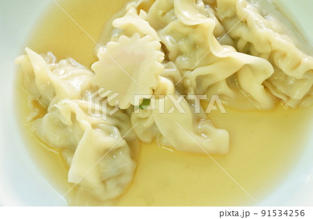 Gyoza Japanese boiled dumplings stuffed chop pork in soup on plate Gyoza Japanese boiled dumplings stuffed chop pork in soup on plate 91534256