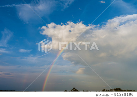 Gorgeous panorama majestic scenic of the multicolored rainbow with clouds in the sky 91538196
