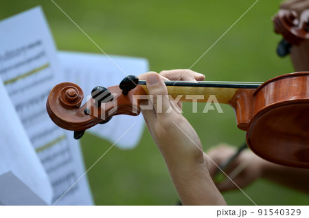Detail of playing the violin Detail of playing the violin 91540329