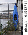 Kayak mounted to a fence 91542714