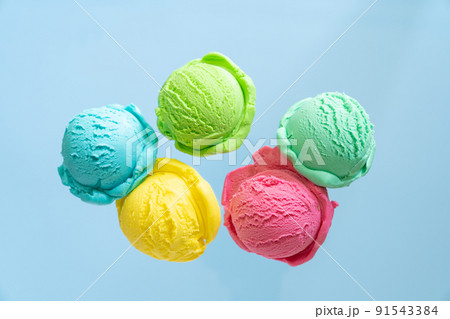Flying ice cream balls on bright background 91543384