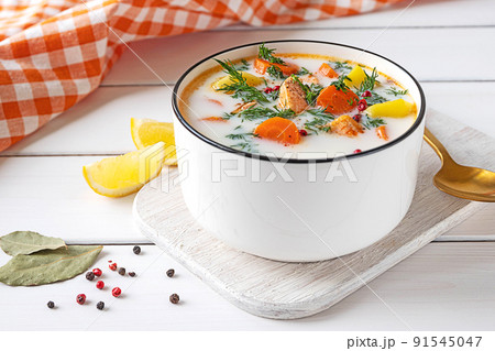 Lohikeitto, Finnish creamy salmon soup in a white bowl Lohikeitto, Finnish creamy salmon soup in a white bowl 91545047
