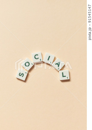 Social formed of scrabble tiles on beige background. Social formed of scrabble tiles on beige background. 91545147