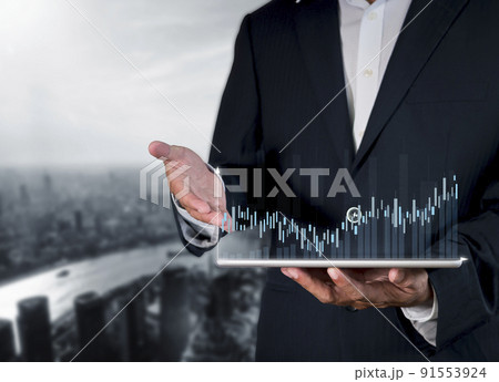 Hand of businessman holding tablet analysis stock market graph growth and increase of chart positive indicators. Hand holding tablet show stock chart on light gray background. copy space banner 91553924