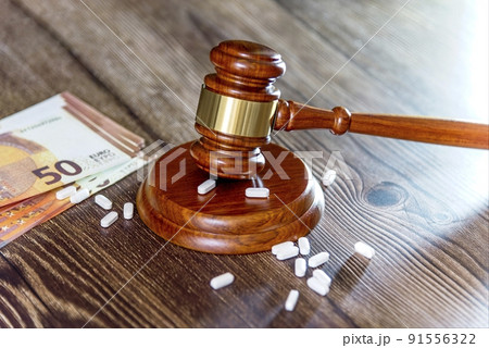 Judges hammer, New Israeli Shekel Notes, syringe and vaccine bottle on a wooden background. Concept for a medical judgment Judges hammer, New Israeli Shekel Notes, syringe and vaccine bottle on a wooden background. Concept for a medical judgment 91556322
