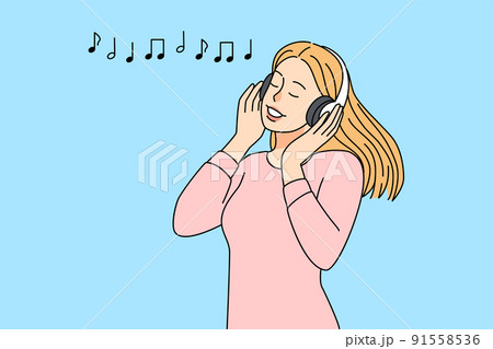 Happy girl listening to music in earphones 91558536