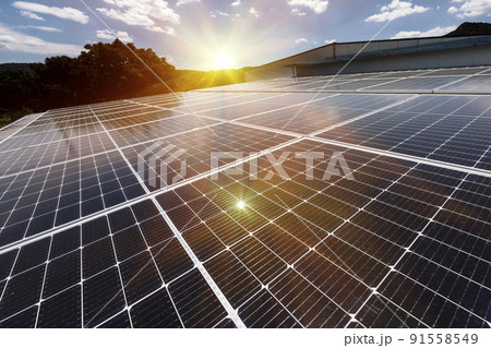 Solar panels on factory roof photovoltaic solar panels absorb sunlight as a source of energy to generate electricity creating sustainable energy 91558549