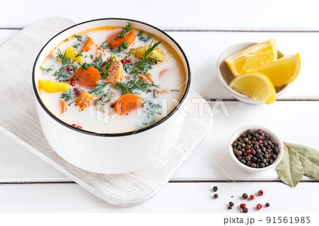 Lohikeitto, Finnish creamy salmon soup in a white bowl Lohikeitto, Finnish creamy salmon soup in a white bowl 91561985