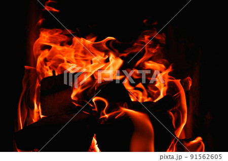 Fire. Photo of flames devouring firewood in a stone fireplace. The texture of the fire in the fireplace. Burning wood inside traditional oven Fire. Photo of flames devouring firewood in a stone fireplace. The texture of the fire in the fireplace. Burning wood inside traditional oven 91562605