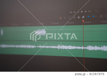Editing and working with sound in a special program. Monitor screen with audio track 91567970