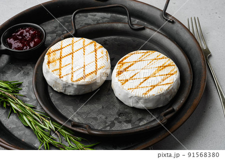 Grilled goat cheese on gray stone table background 91568380