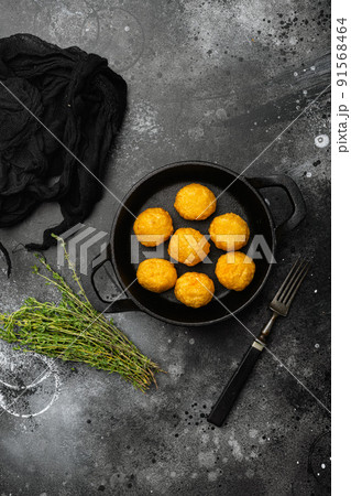 Breaded chicken fillet and batter on black dark stone table background, top view flat lay, with copy space for text Breaded chicken fillet and batter on black dark stone table background, top view flat lay, with copy space for text 91568464