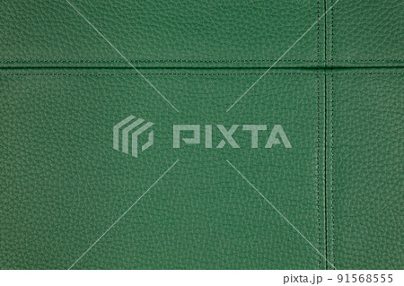 Green leather, leatherette texture background wtih decorative stich 91568555