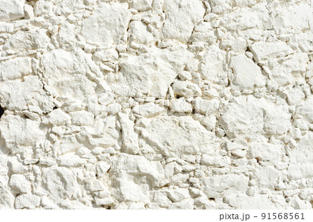 White aged plaster wall with crack background White aged plaster wall with crack background 91568561