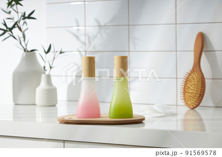 Top view of cosmetic jar in white bathroom with glassware and flower for cosmetic advertising , lifestyle content 91569578