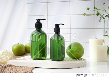 Top view of cosmetic jar in white bathroom with glassware and flower for cosmetic advertising , lifestyle content 91569579