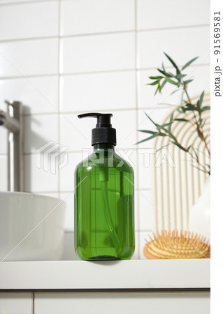 Top view of cosmetic jar in white bathroom with glassware and flower for cosmetic advertising , lifestyle content 91569581
