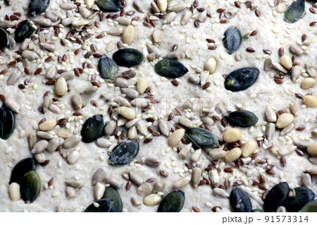 Different seeds decorate bread and other pastries. Different seeds decorate bread and other pastries. 91573314