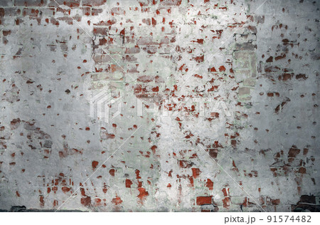 Dilapidated building facade with damaged plaster Dilapidated building facade with damaged plaster 91574482