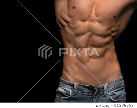 Muscular male torso isolated on black background Muscular male torso isolated on black background 91576955