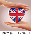 Two hands holding heart with flag of Untied Kingdom. Concept of love, freedom, independence and England country support. 3D rendering. 91578061