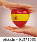 Two hands holding heart with flag of Spain. Concept of love, freedom, independence and country support. 3D rendering. 91578063
