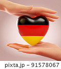 Two hands holding heart with flag of Germany. Concept of love, freedom, independence and country support. 3D rendering. 91578067