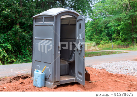 Construction site portable restrooms for workers 91578675