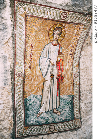 Mosaic depicting a man with a book and a censer in his hands. Ostrog monastery, Montenegro 91583477