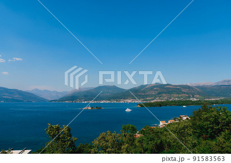 Island of Otocic Gospa in the turquoise bay. Montenegro Island of Otocic Gospa in the turquoise bay. Montenegro 91583563